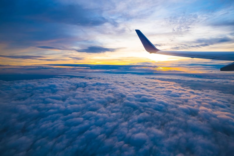 Airplane wing amongst the clouds