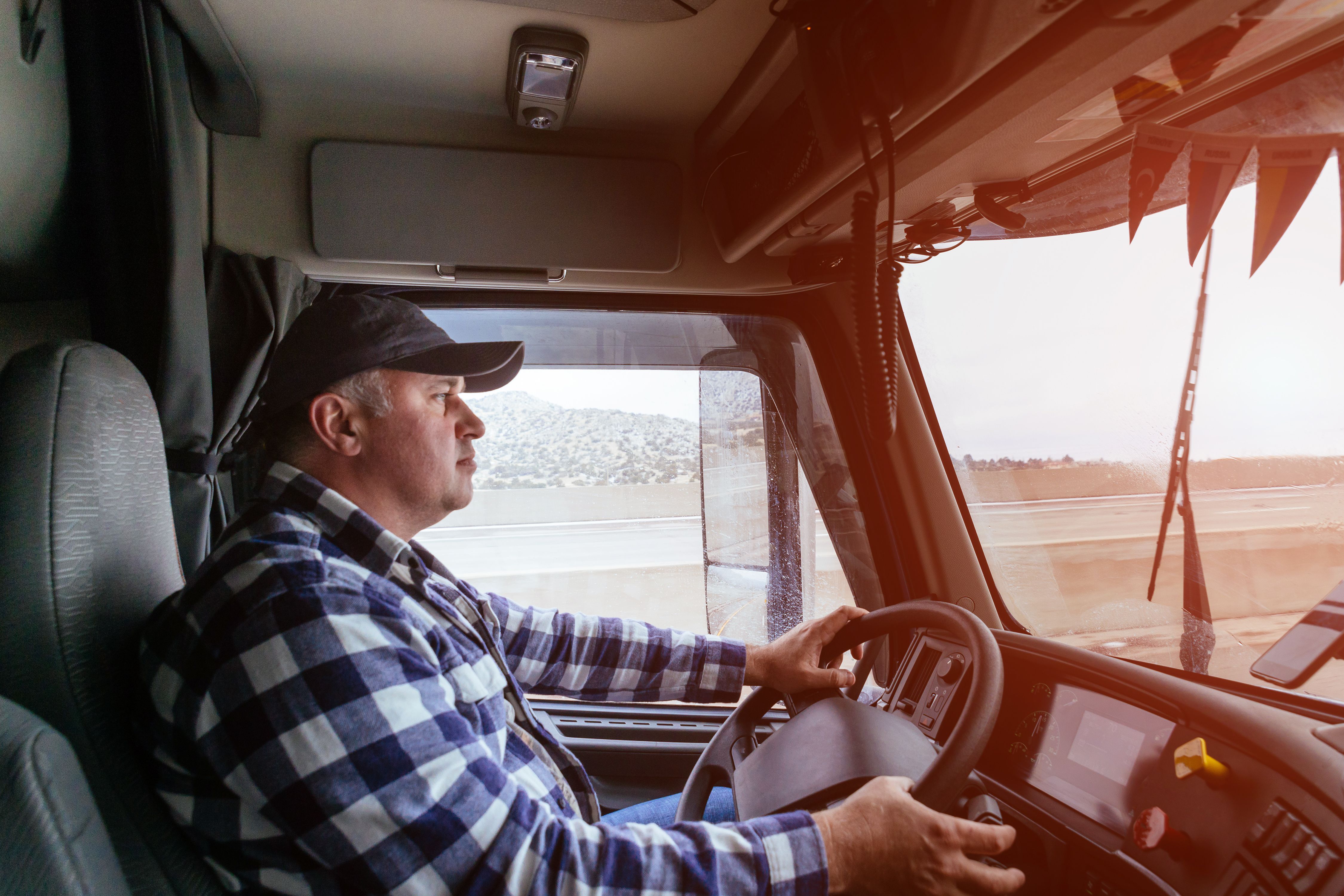 Truck drivers big truck right traffic hands holding radio and steering wheel