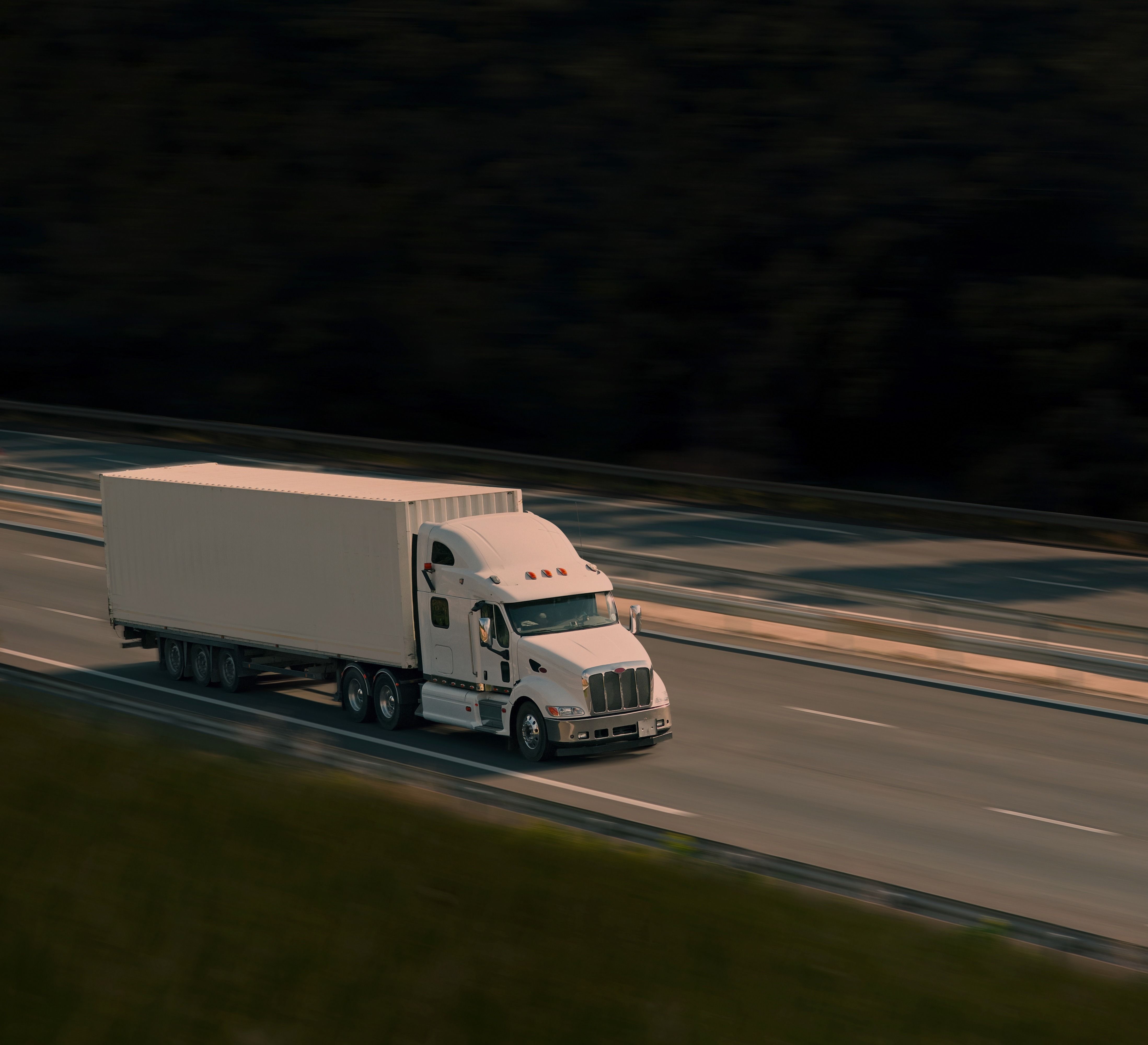 White truck driving on the road